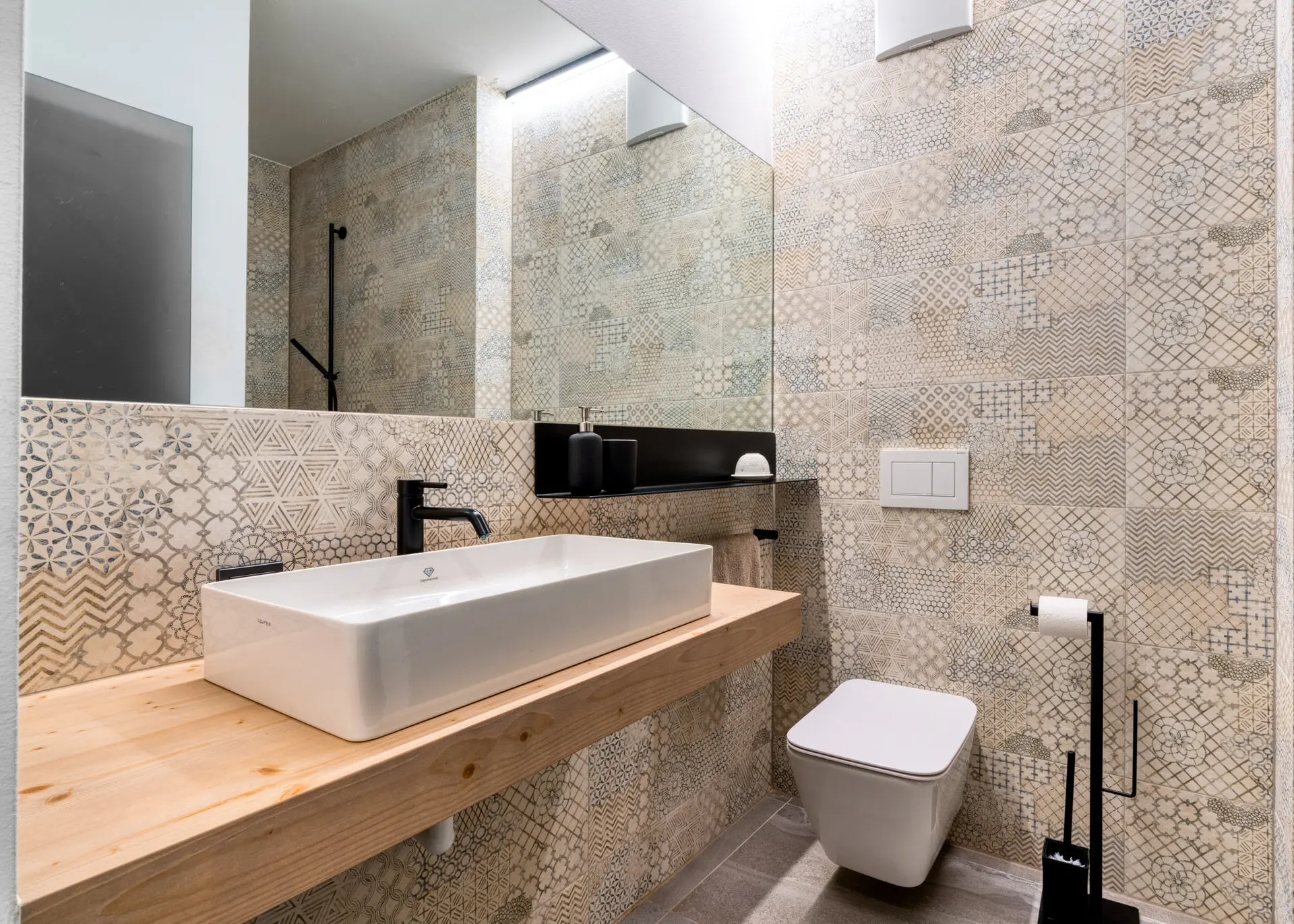 Bathroom with patterned tile vanity in Hinterstoder luxury residence