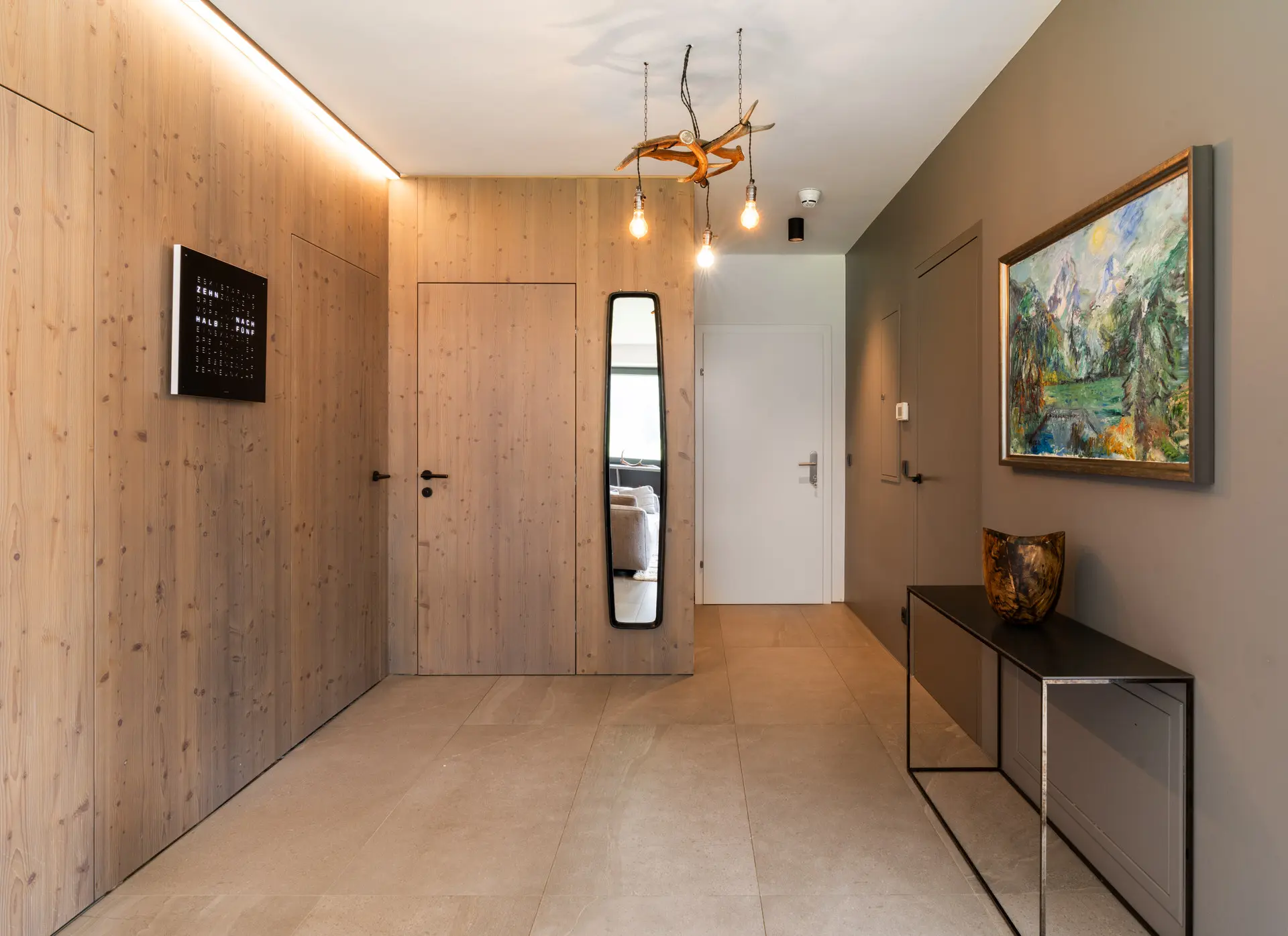 Hallway with antler chandelier in Hinterstoder alpine residence