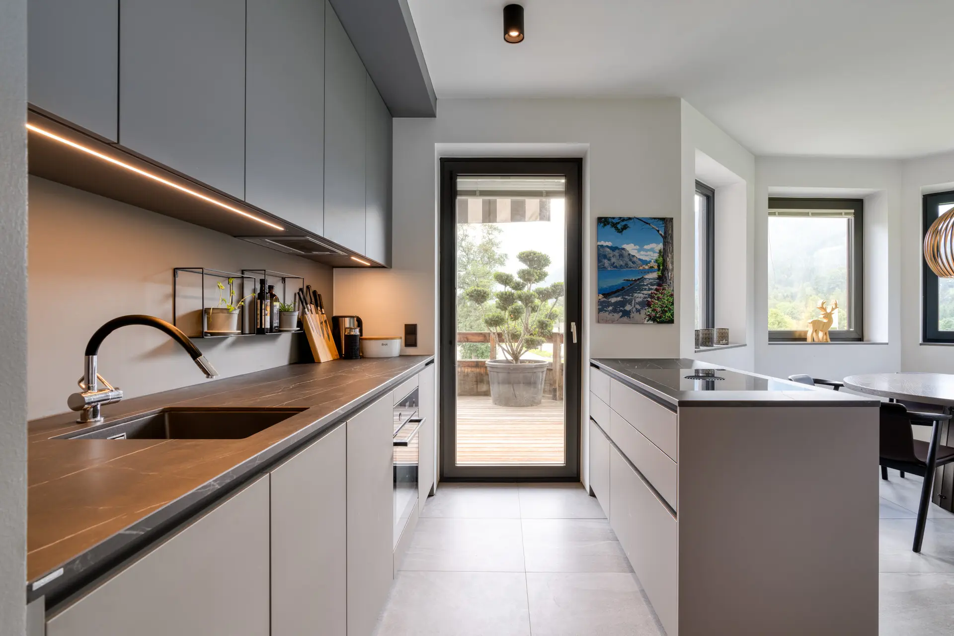 Galley kitchen with terrace view in Hinterstoder ski residence
