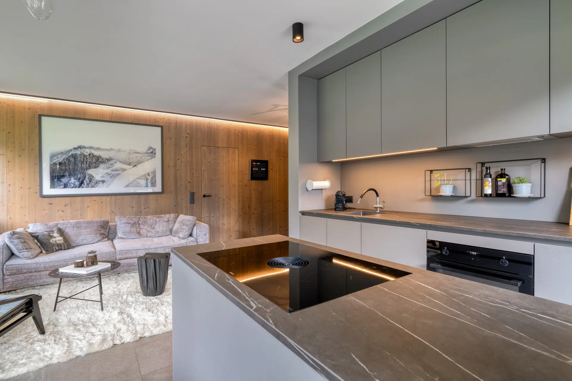 Open-plan kitchen with marble island in Hinterstoder alpine ski residence