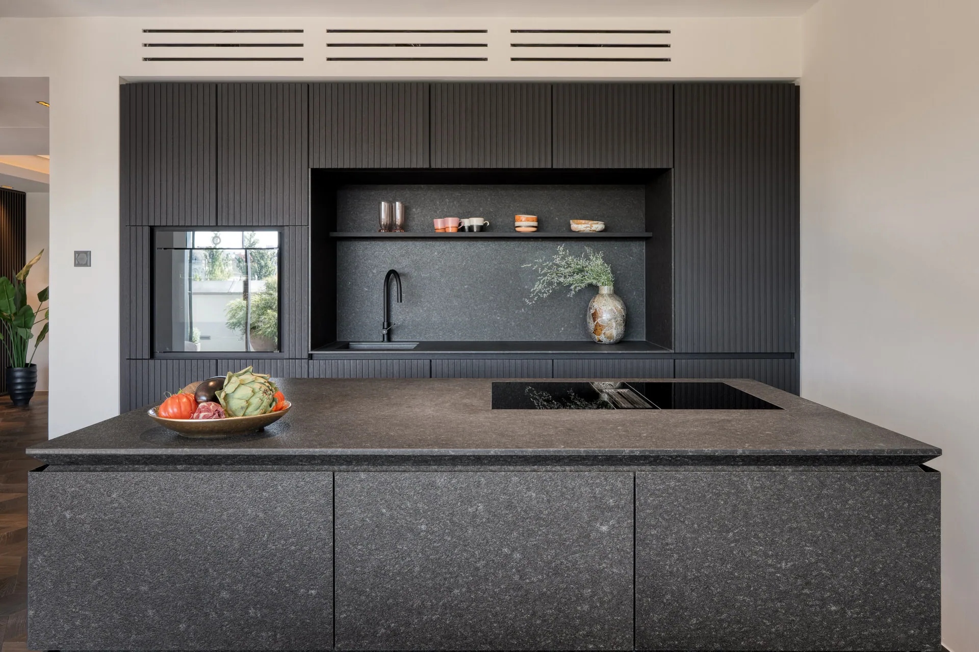 Dark stone kitchen island detail in luxury Vienna penthouse