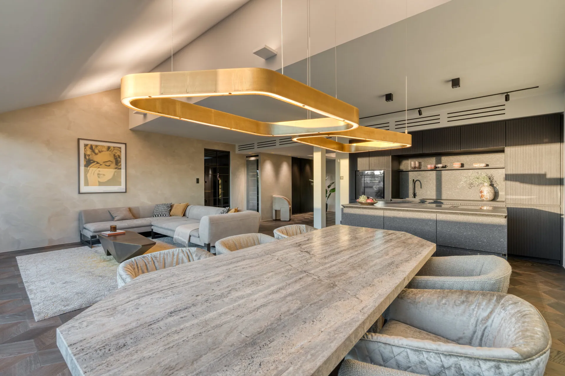 Open-plan living area in exclusive Vienna penthouse with Baxter and Henge furniture