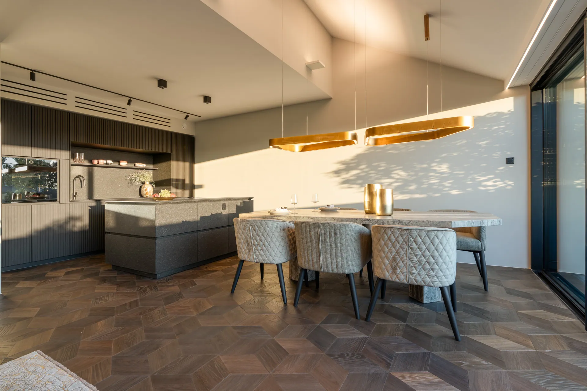 eggersmann kitchen and dining area with gold pendant lighting in Vienna penthouse