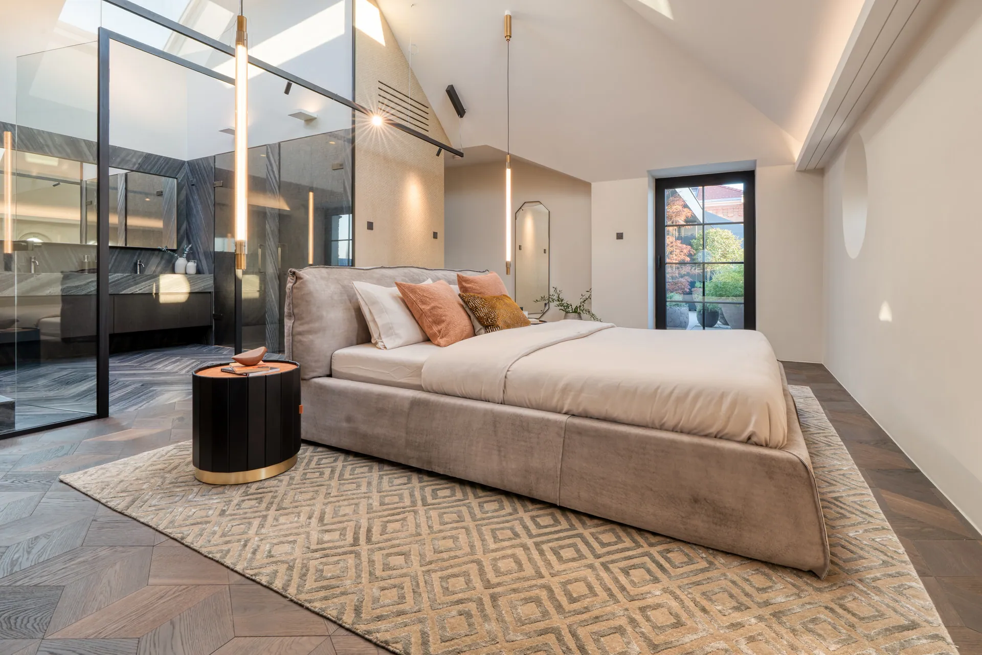 Master bedroom with glass-walled ensuite bathroom in Vienna penthouse