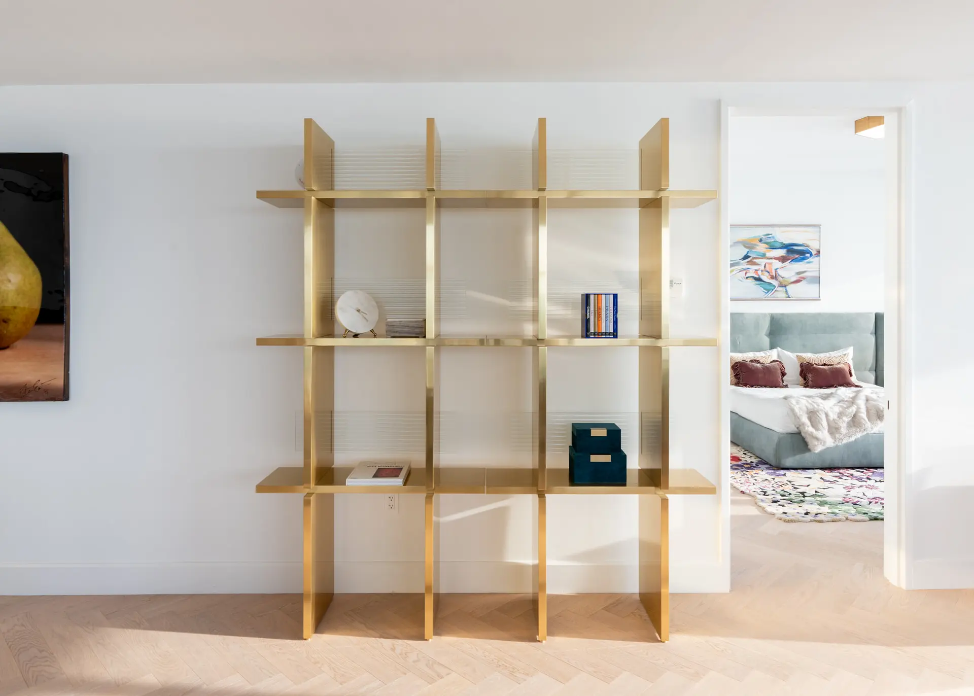 Brass open grid shelving unit in Miami luxury penthouse