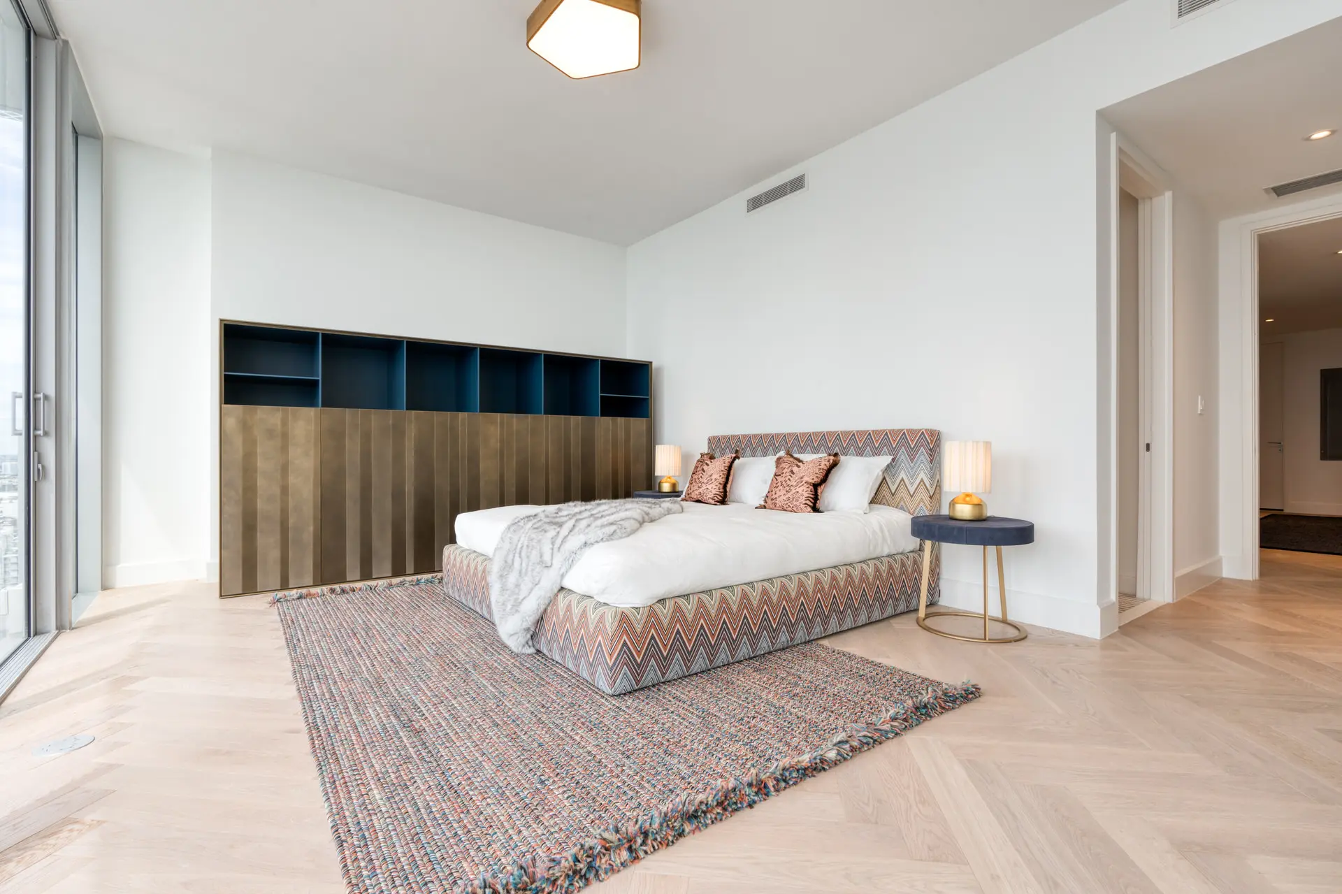 Missoni bedroom with bronze feature wall in luxury Miami condo
