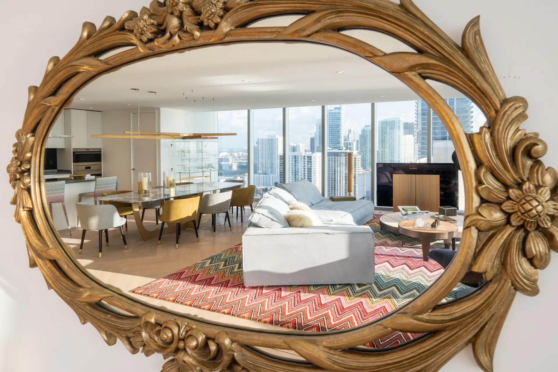 Miami penthouse living room with decorative mirror reflection