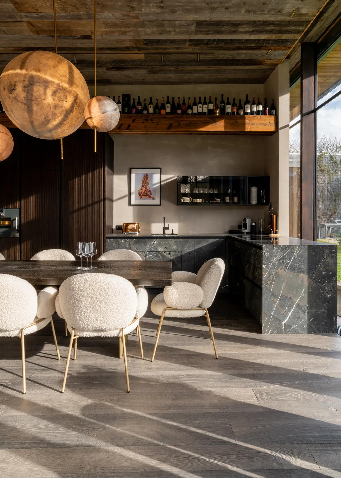 Freifrau dining chairs and natural stone kitchen island in Kitzbuehel chalet