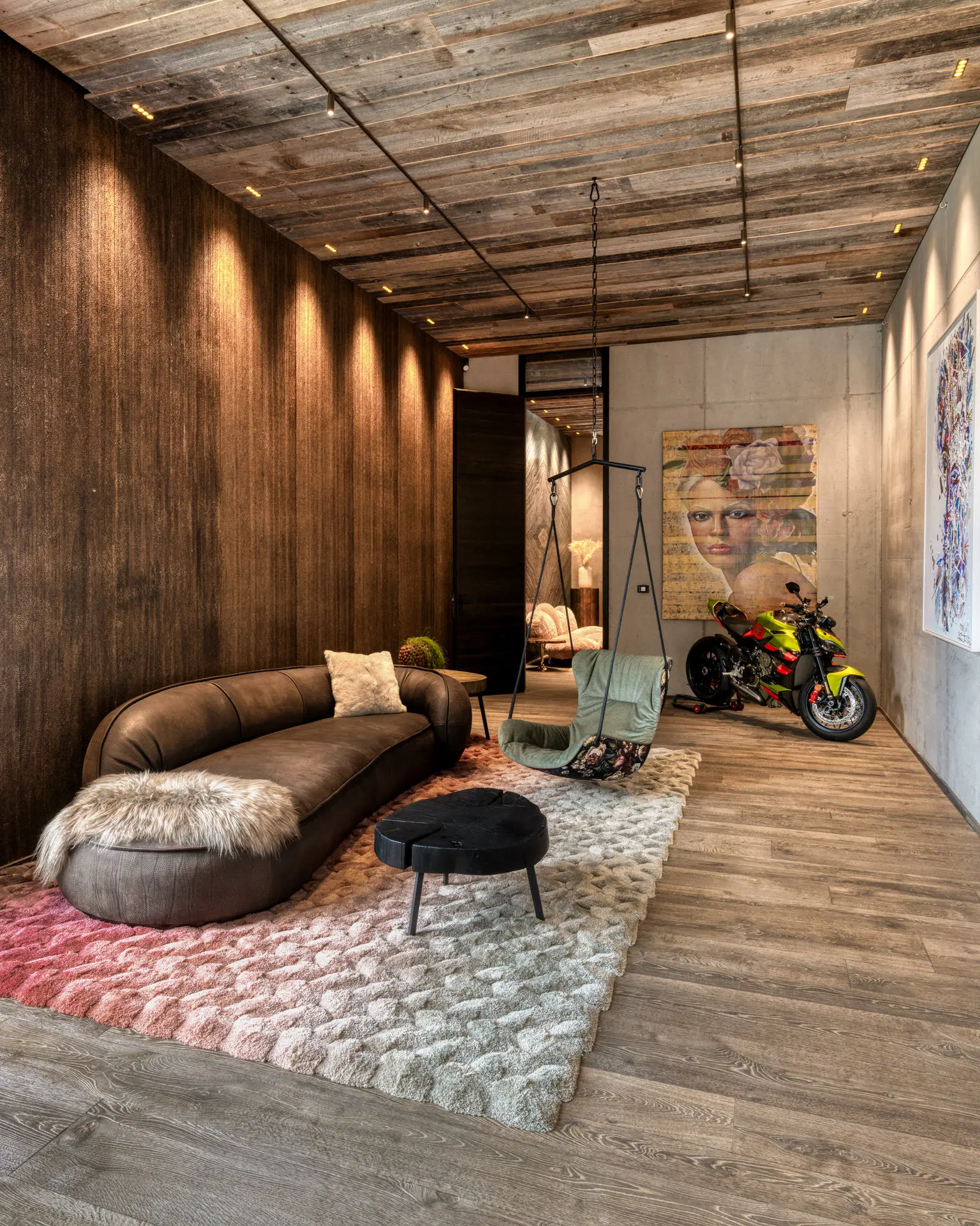Baxter Leon sofa with motorcycle display in Kitzbuehel chalet gallery