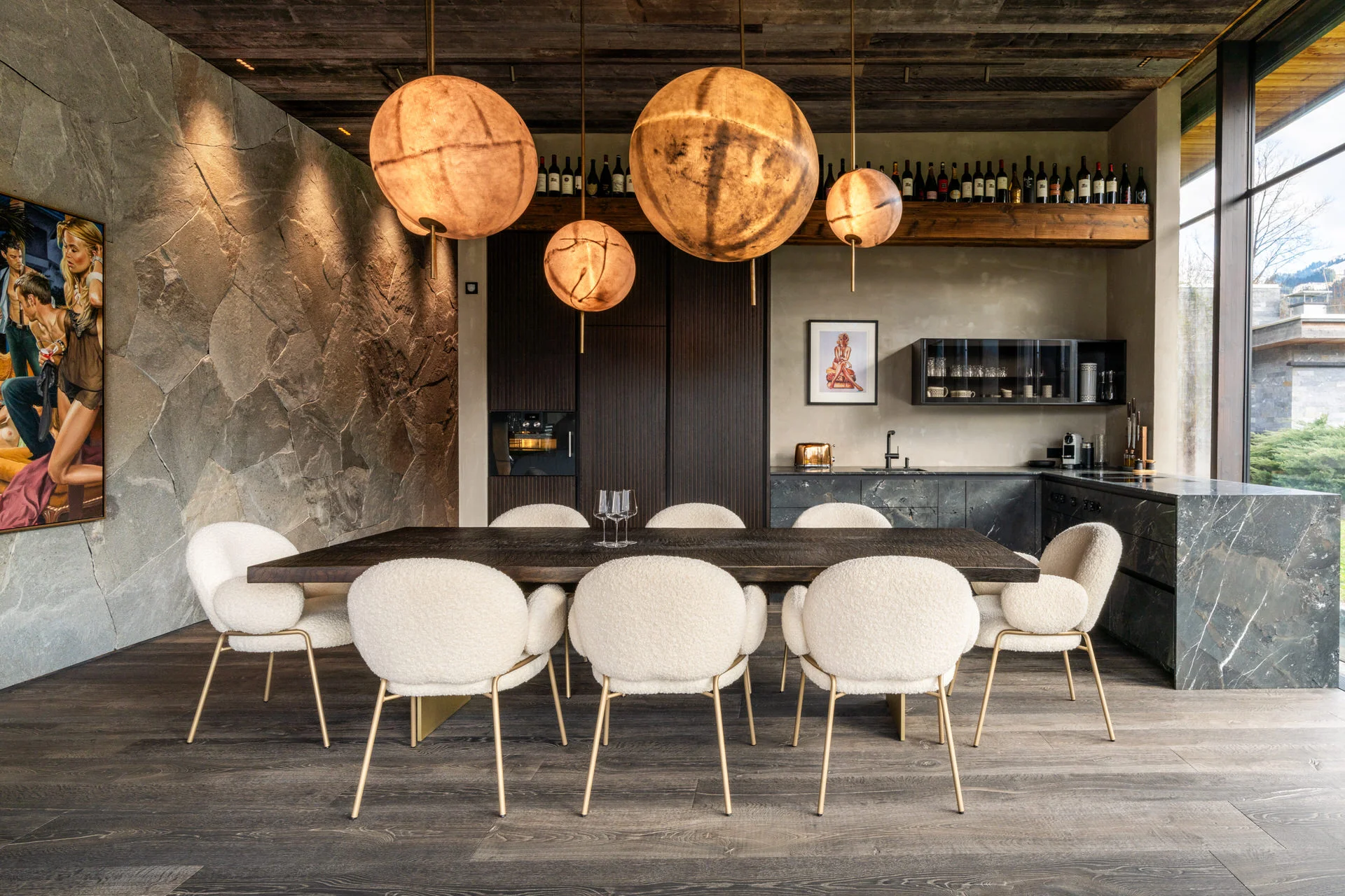 Janua dining table with globe pendants in luxury Kitzbühel chalet