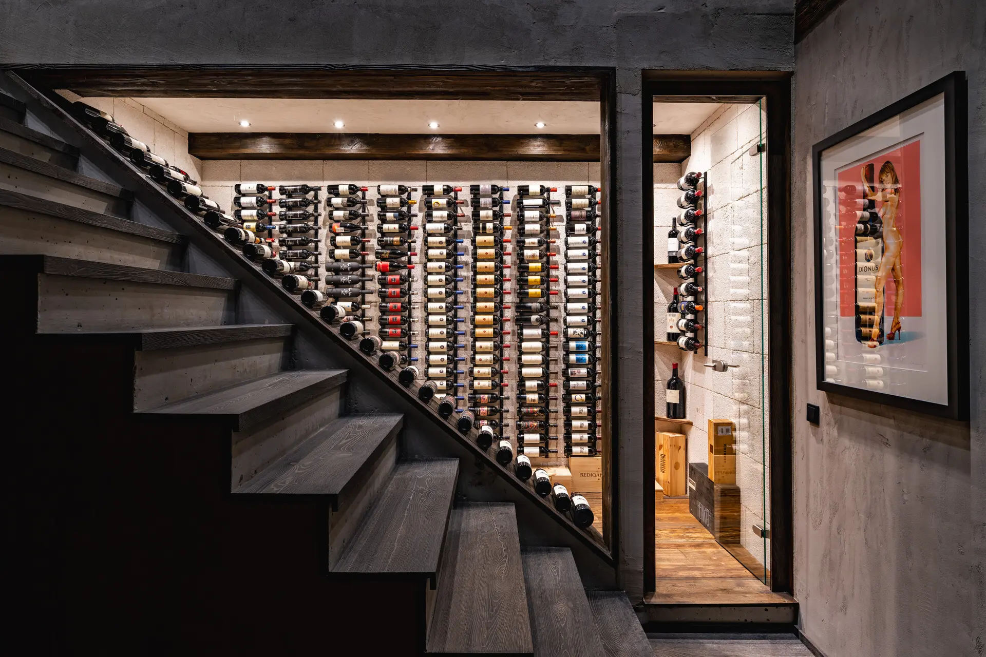 Staircase with wine cellar display in Kitzbuehel luxury chalet