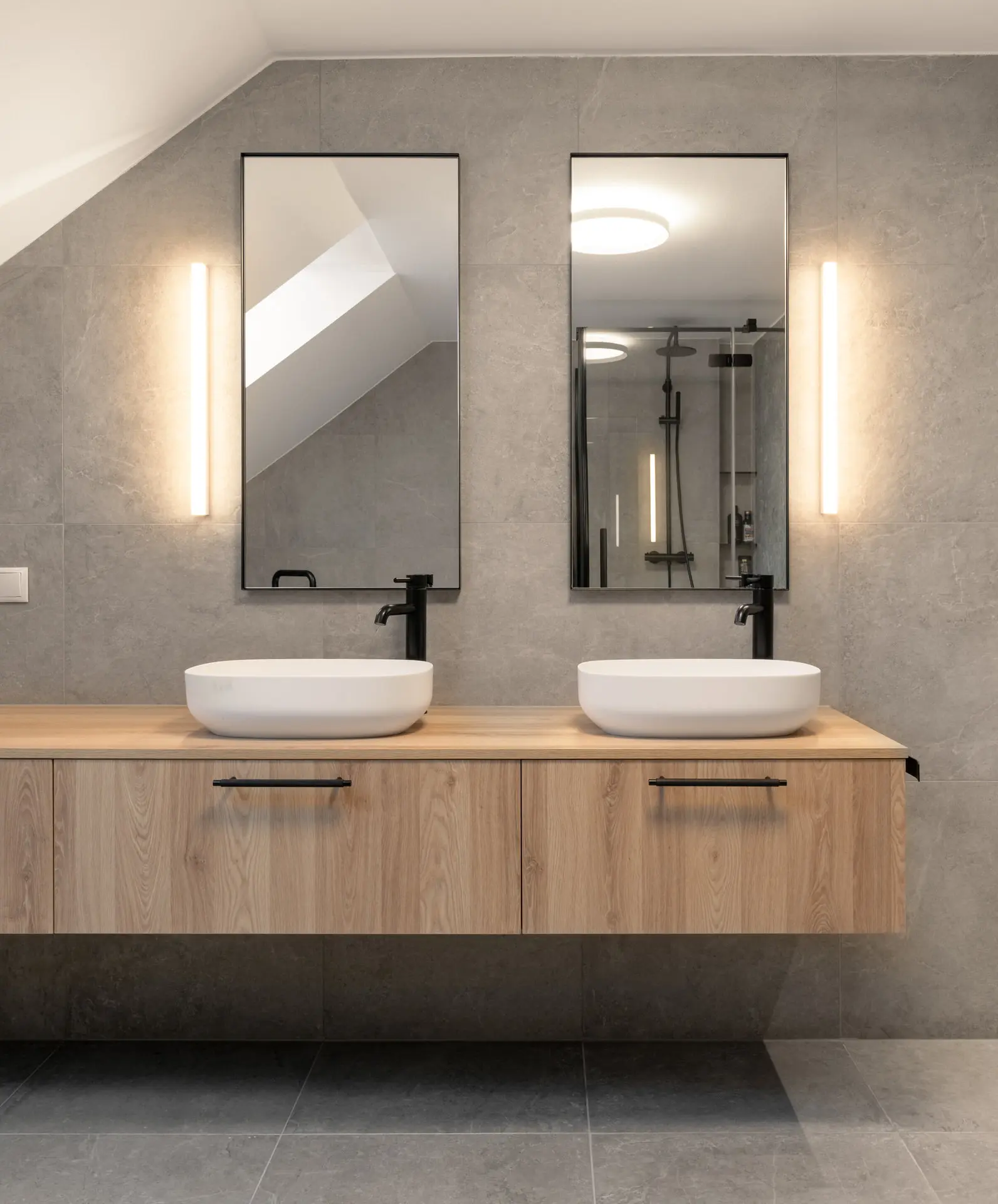 Dual vessel sinks in luxury bathroom of Linz apartment