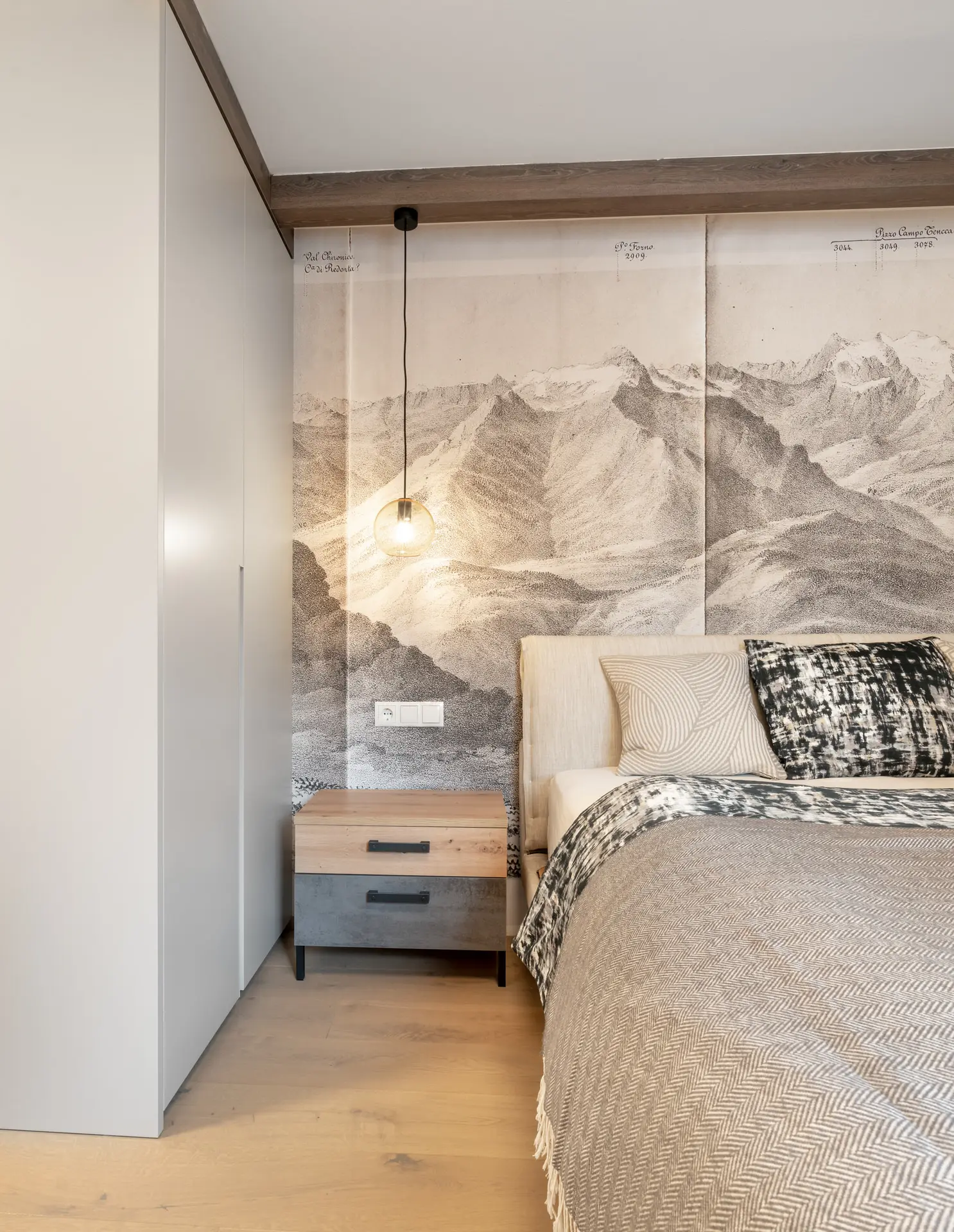 Mountain mural detail in bedroom of modern Linz apartment
