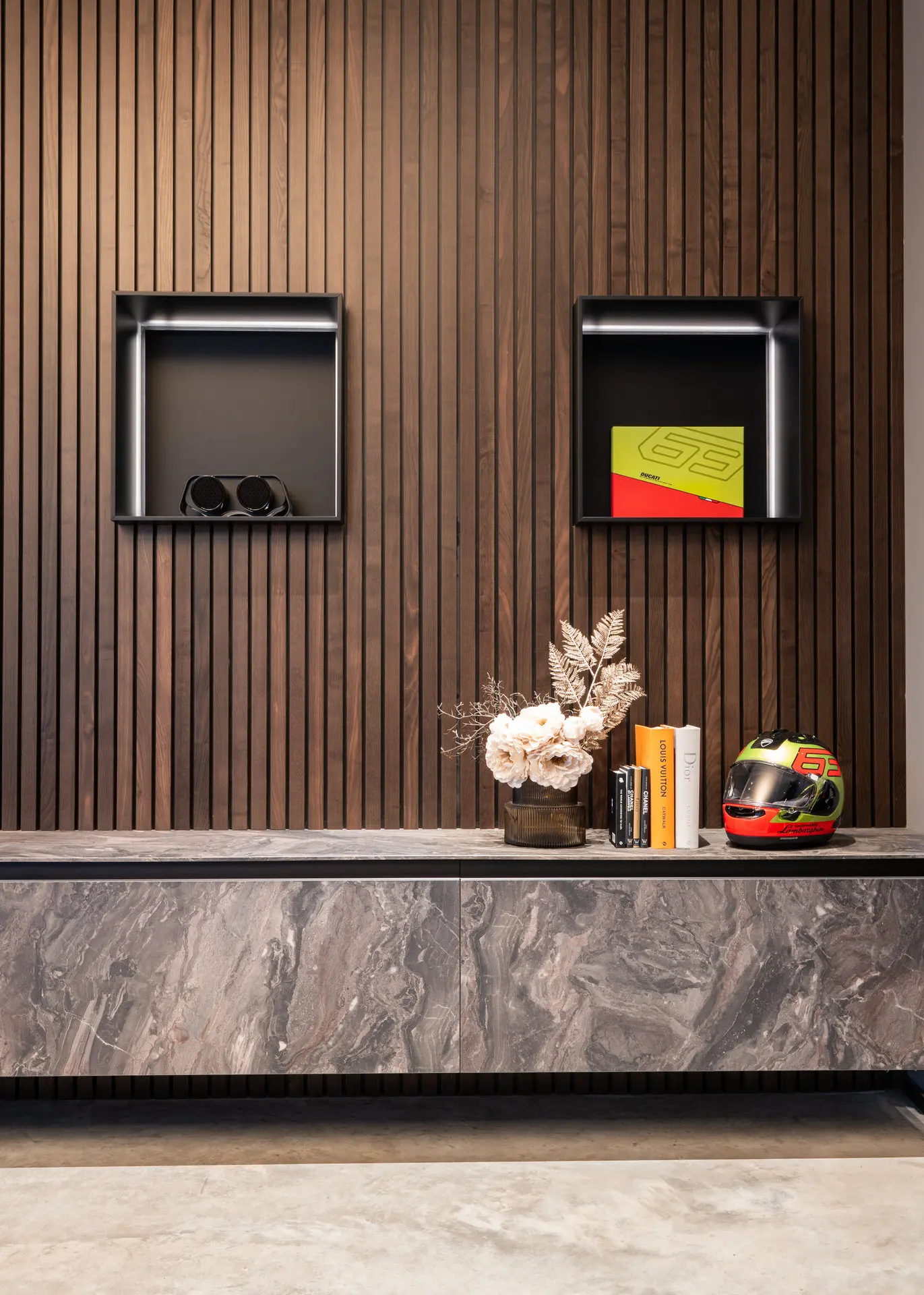 Display niche with racing helmet and accessories in showroom