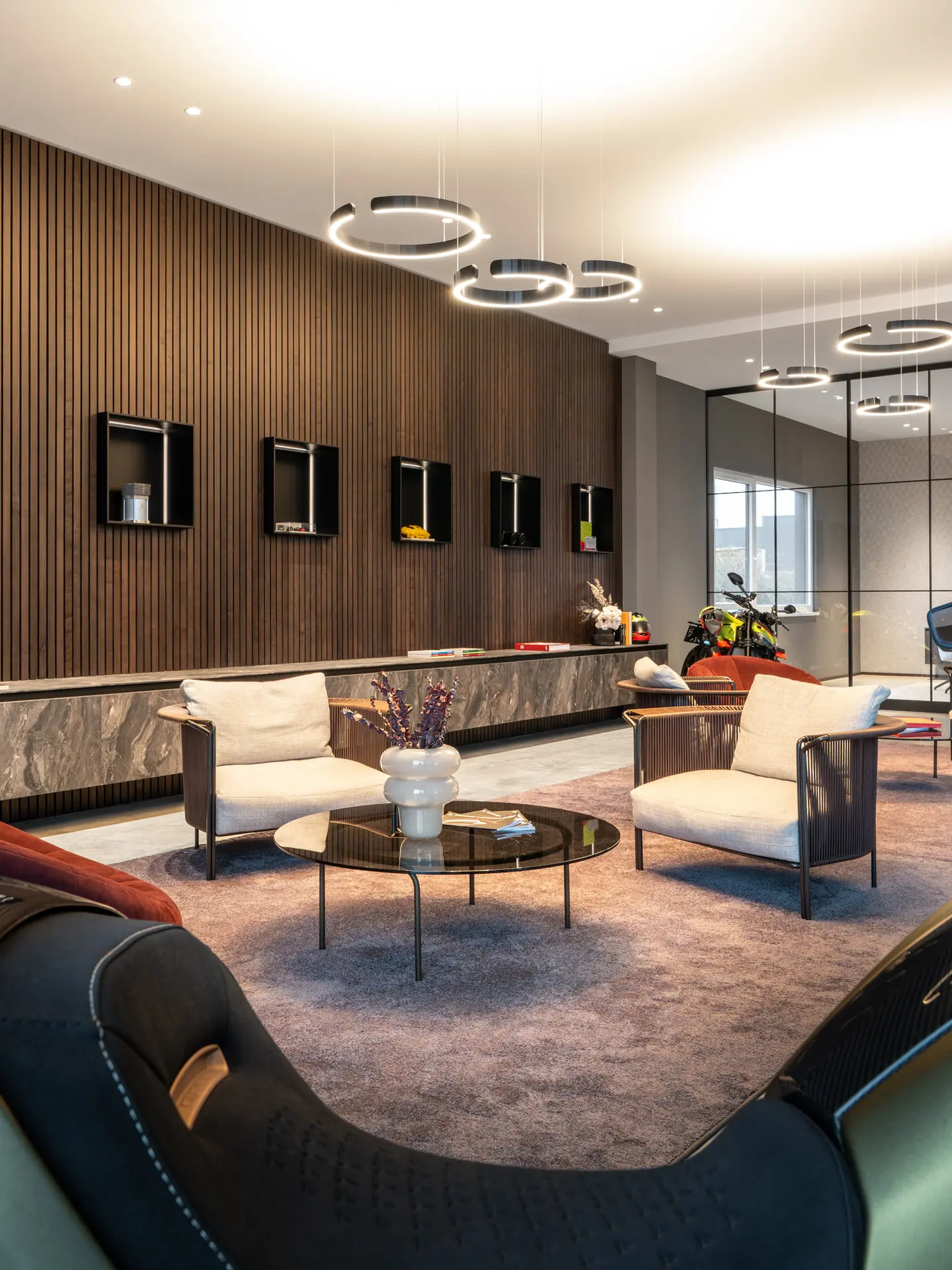 Lounge armchairs with glass partition in luxury showroom