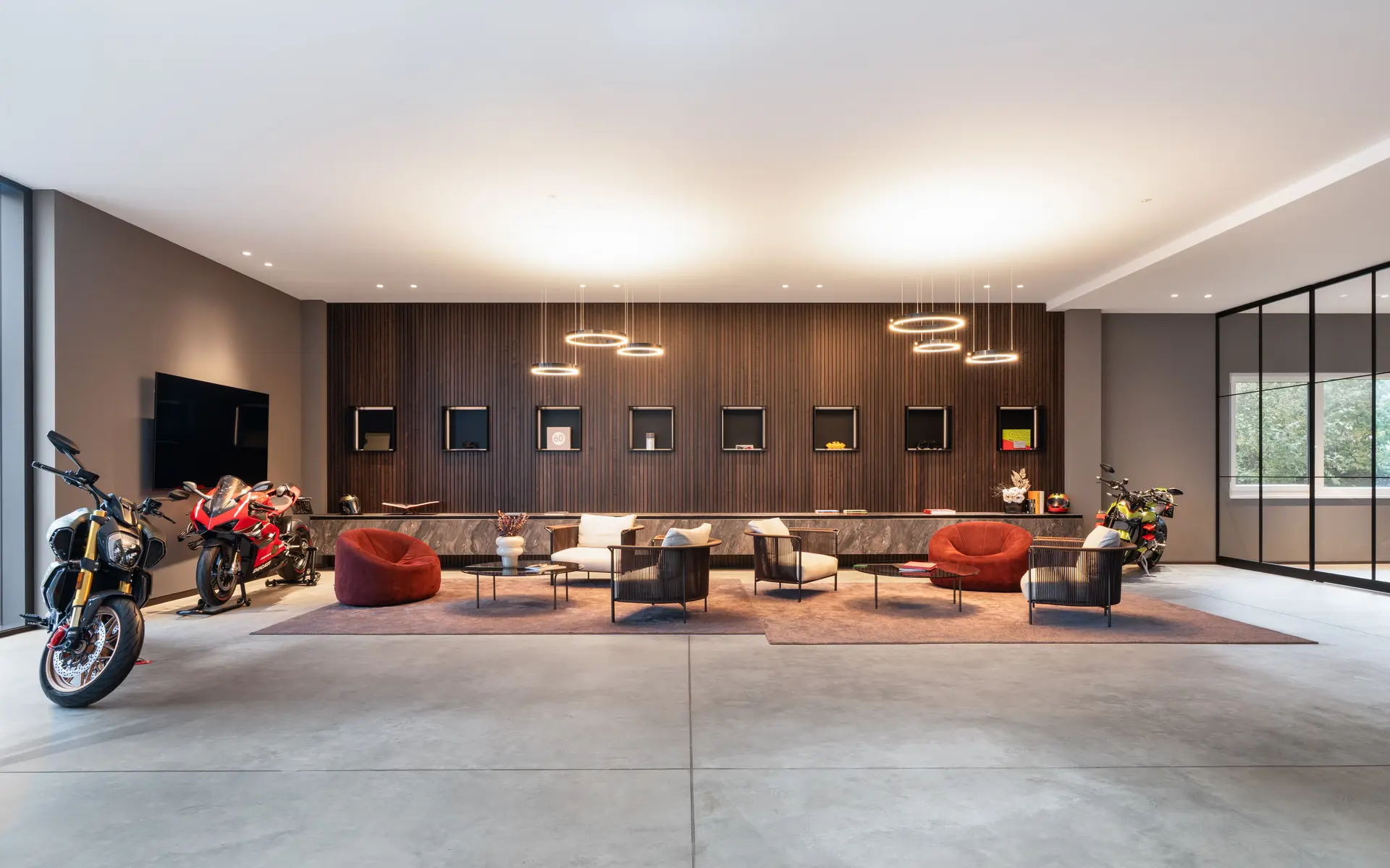 Lounge with full motorcycle display at TP Automobil Manufaktur
