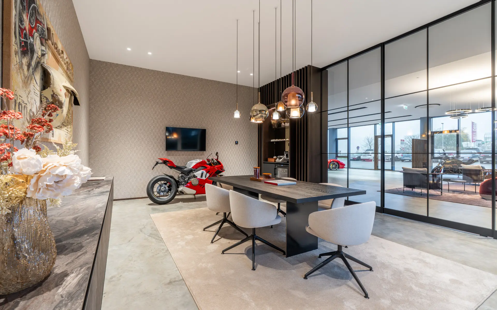 Meeting room with Ducati visible through glass wall