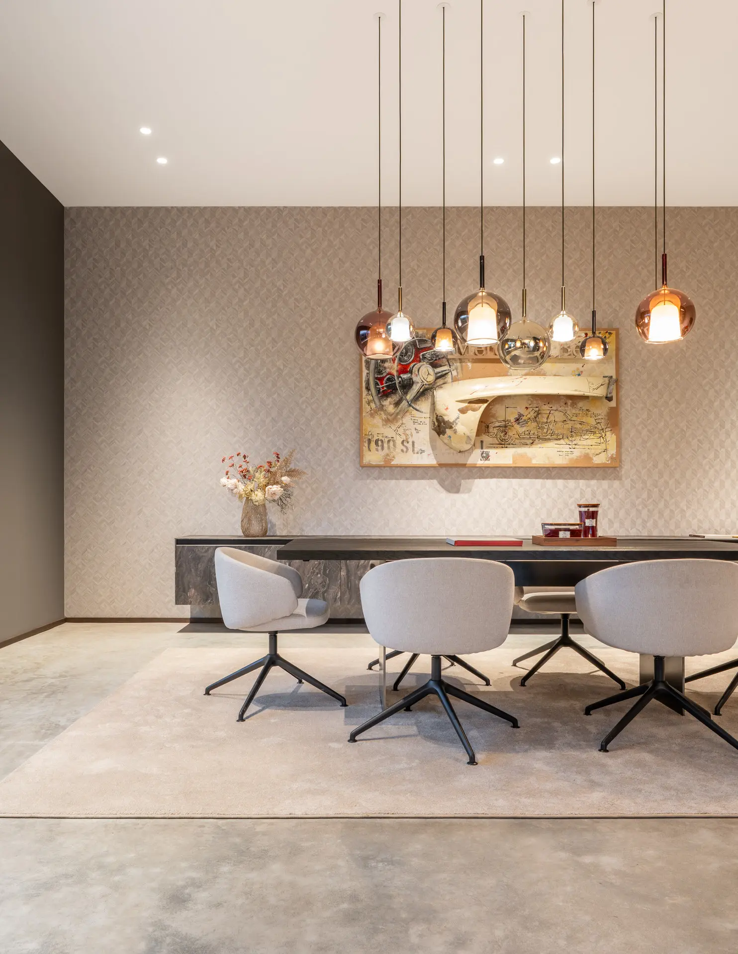 Private meeting room with globe pendant lights in luxury showroom