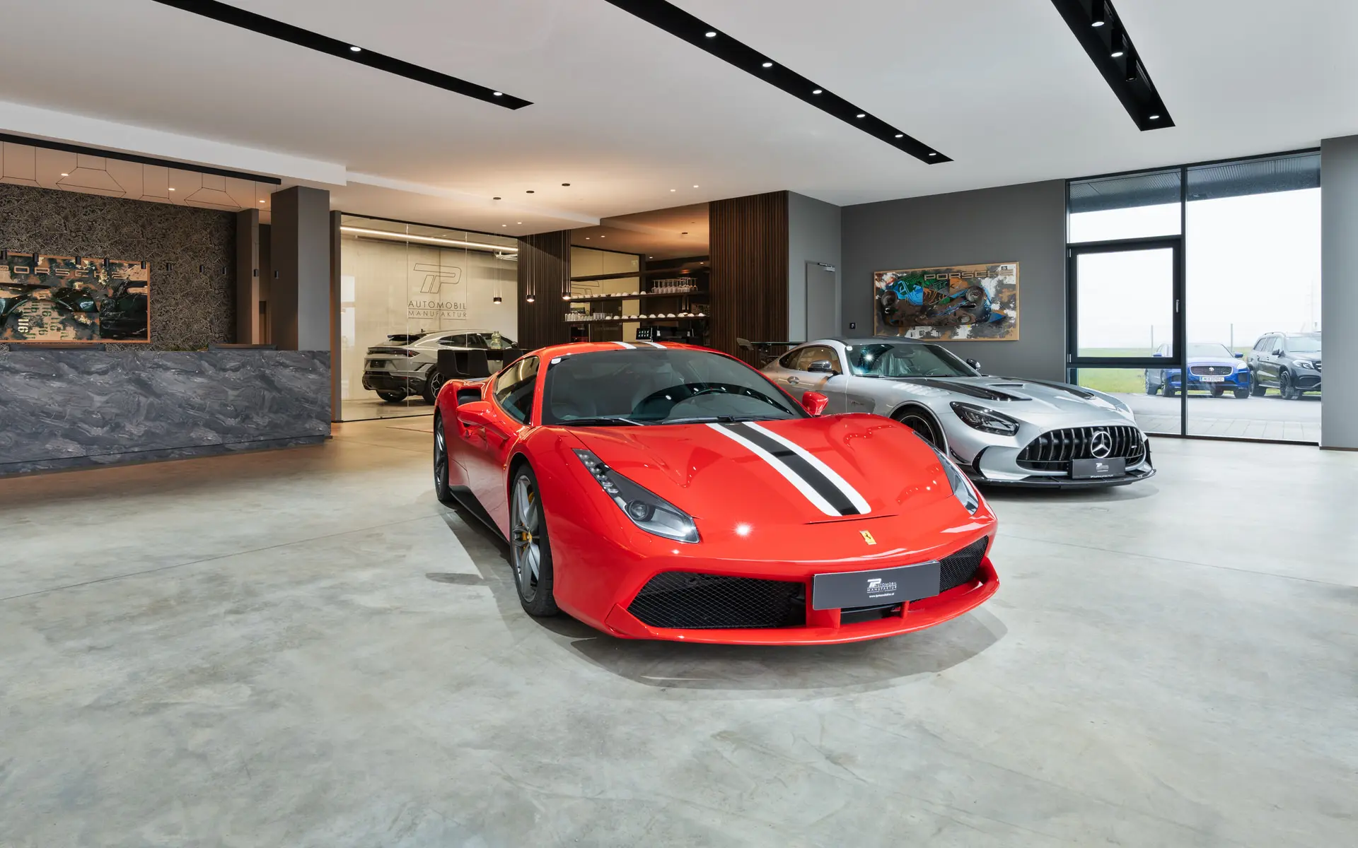 Ferrari and AMG on the showroom floor at TP Automobil Manufaktur in Gaenserndorf