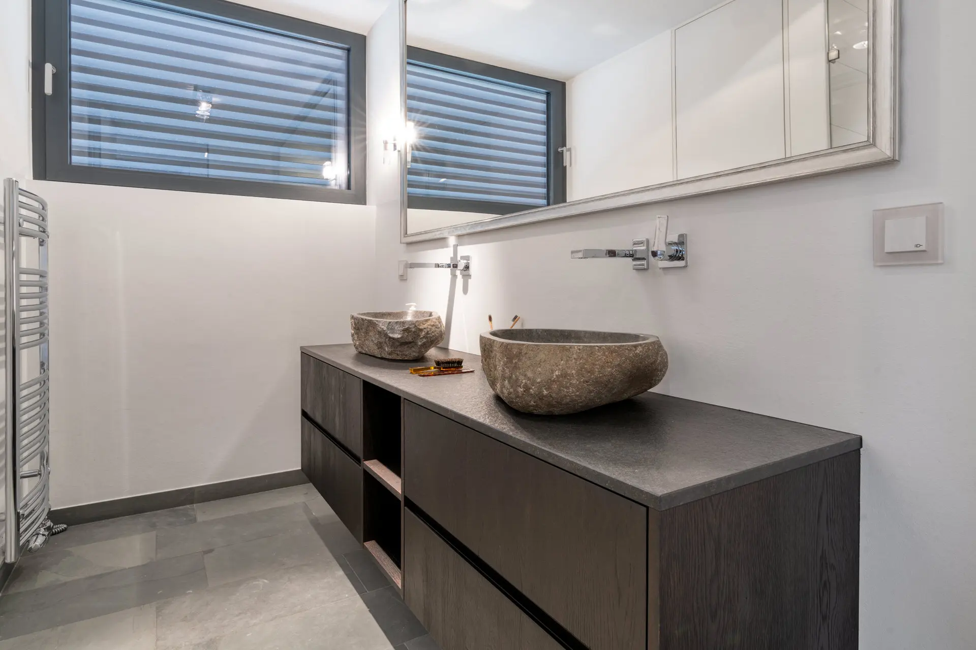 Bathroom with stone vessel sinks in Kitzbuehel private villa