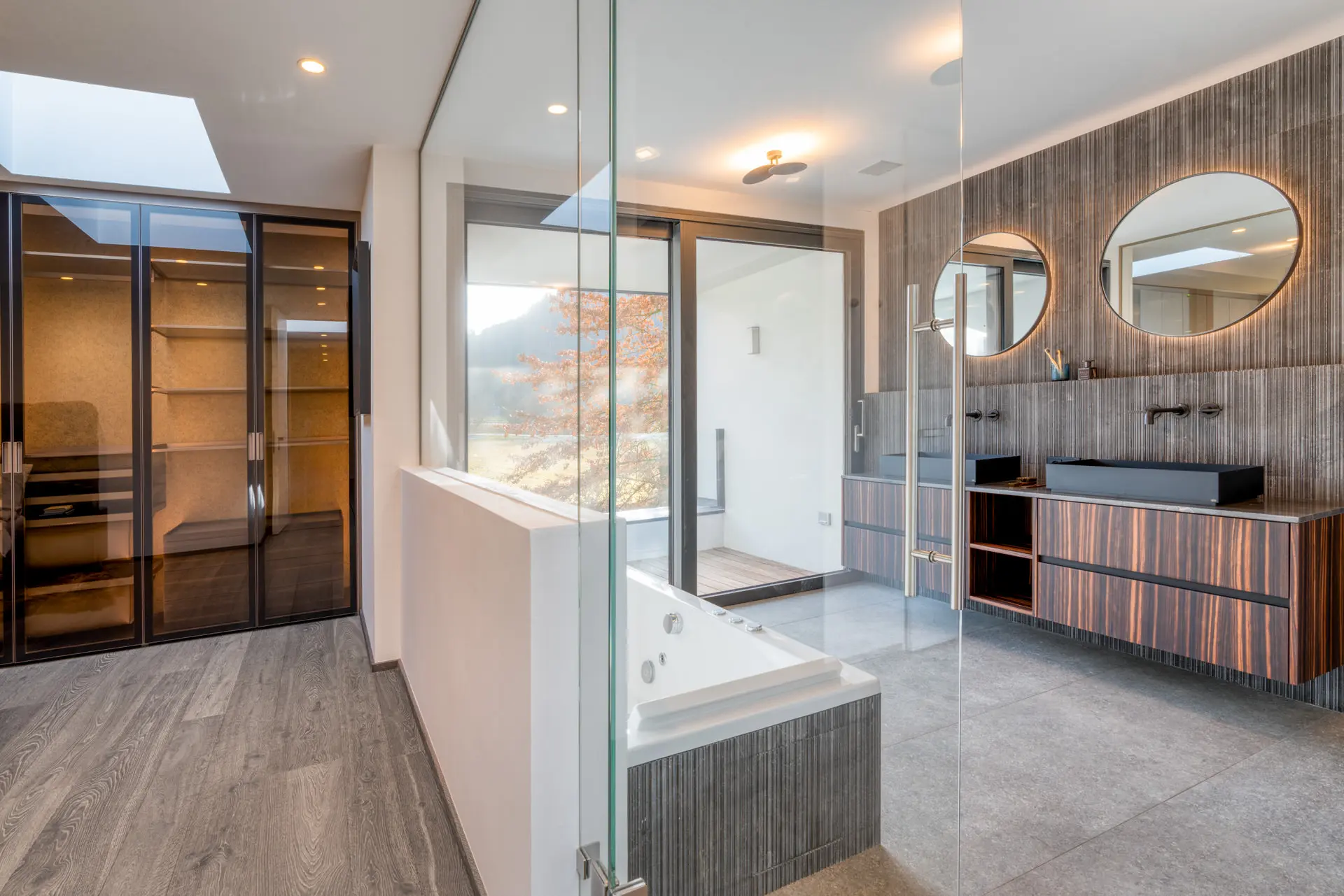 Ensuite bath with glass partition in Kitzbuehel luxury residence