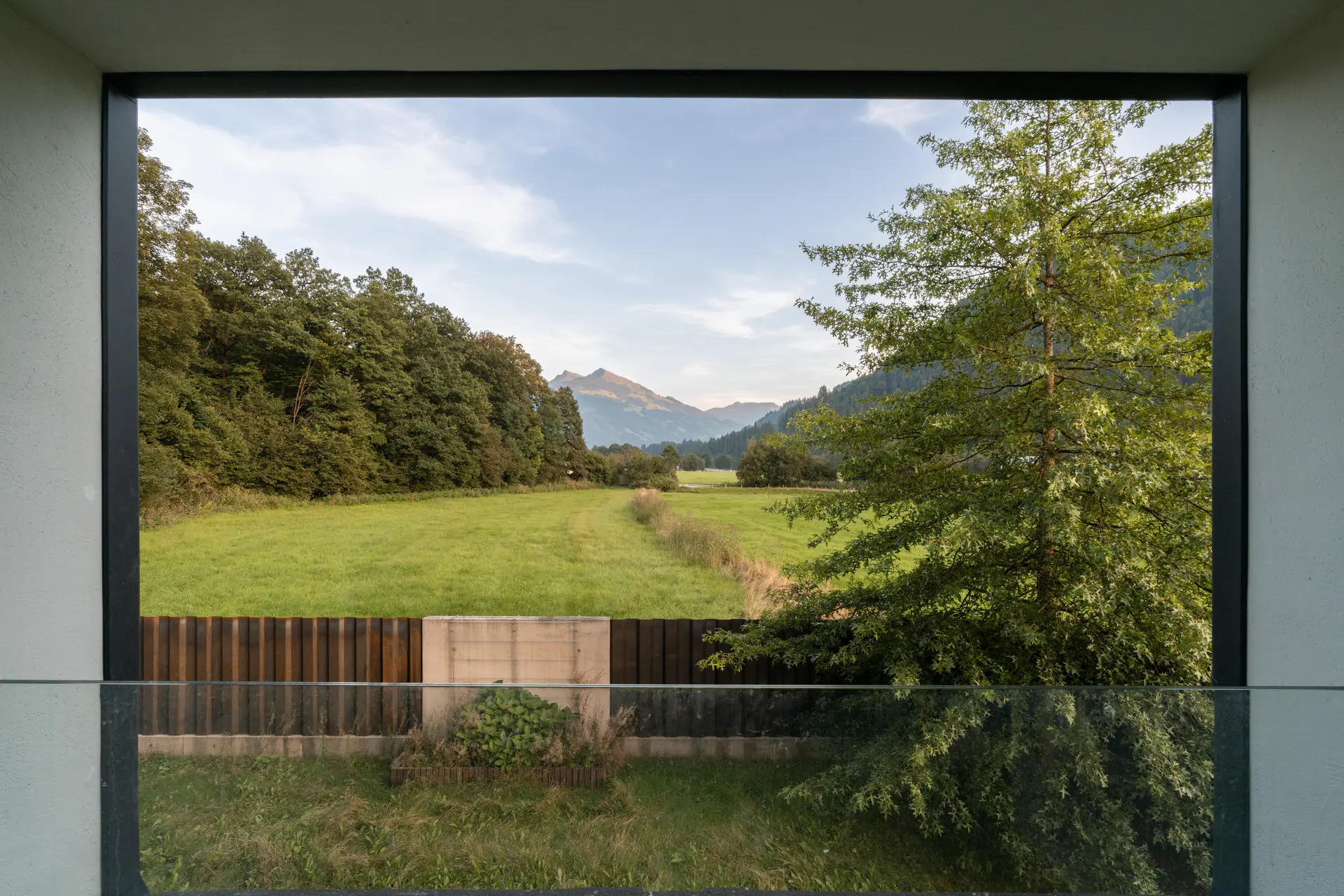 Floor-to-ceiling glazing with alpine view in Kitzbuehel luxury villa