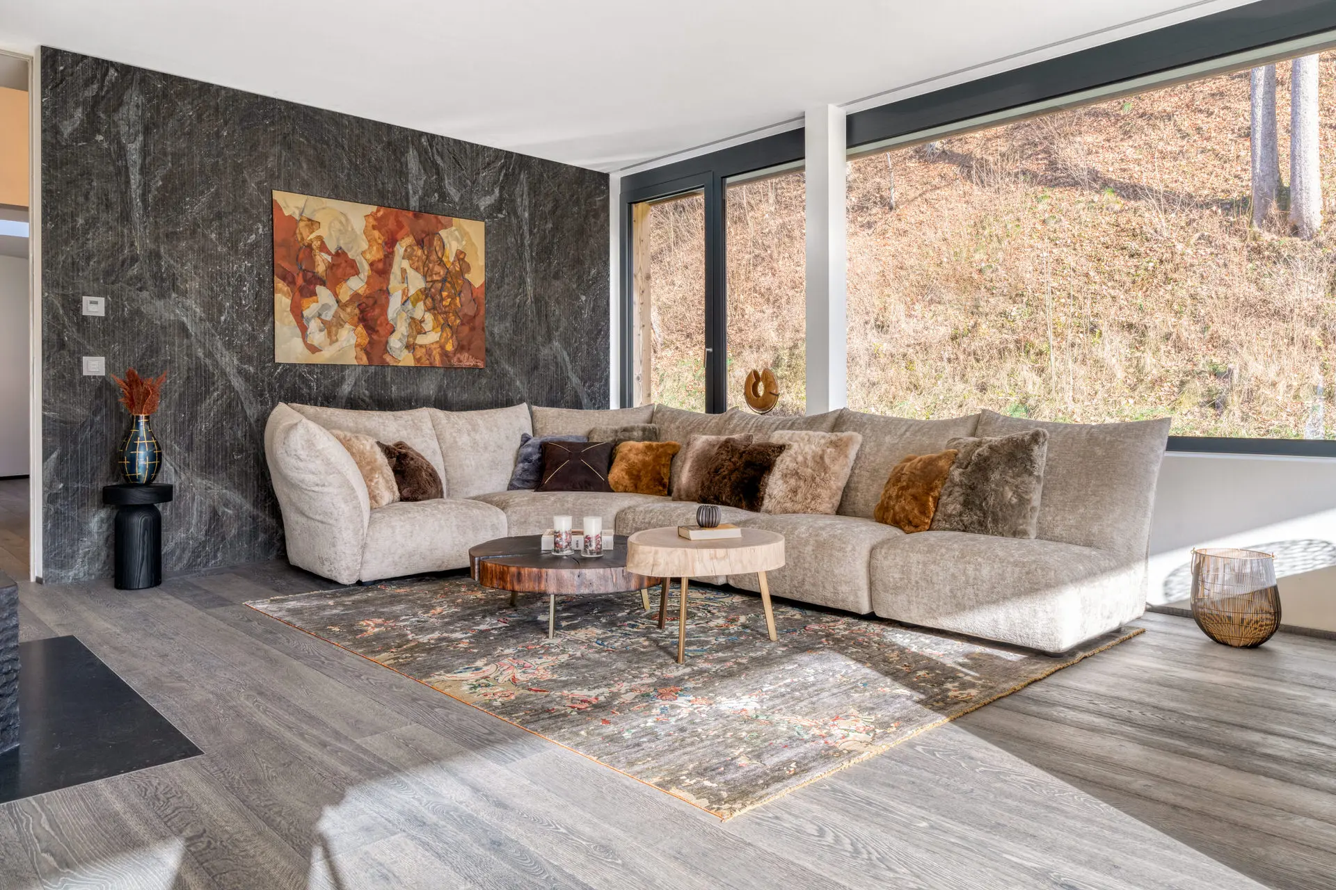 Living room with marble feature wall in Kitzbuehel private residence