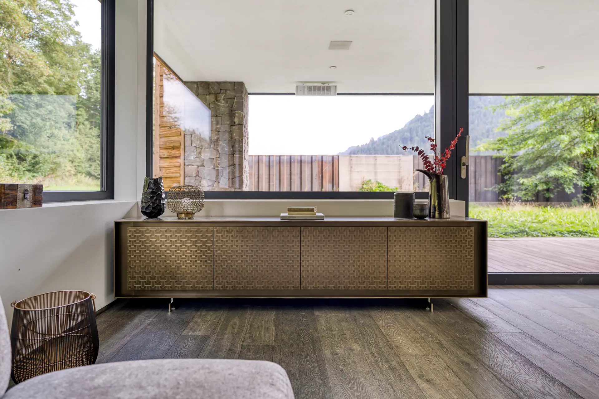 Living room sideboard with summer alpine landscape in Kitzbuehel villa