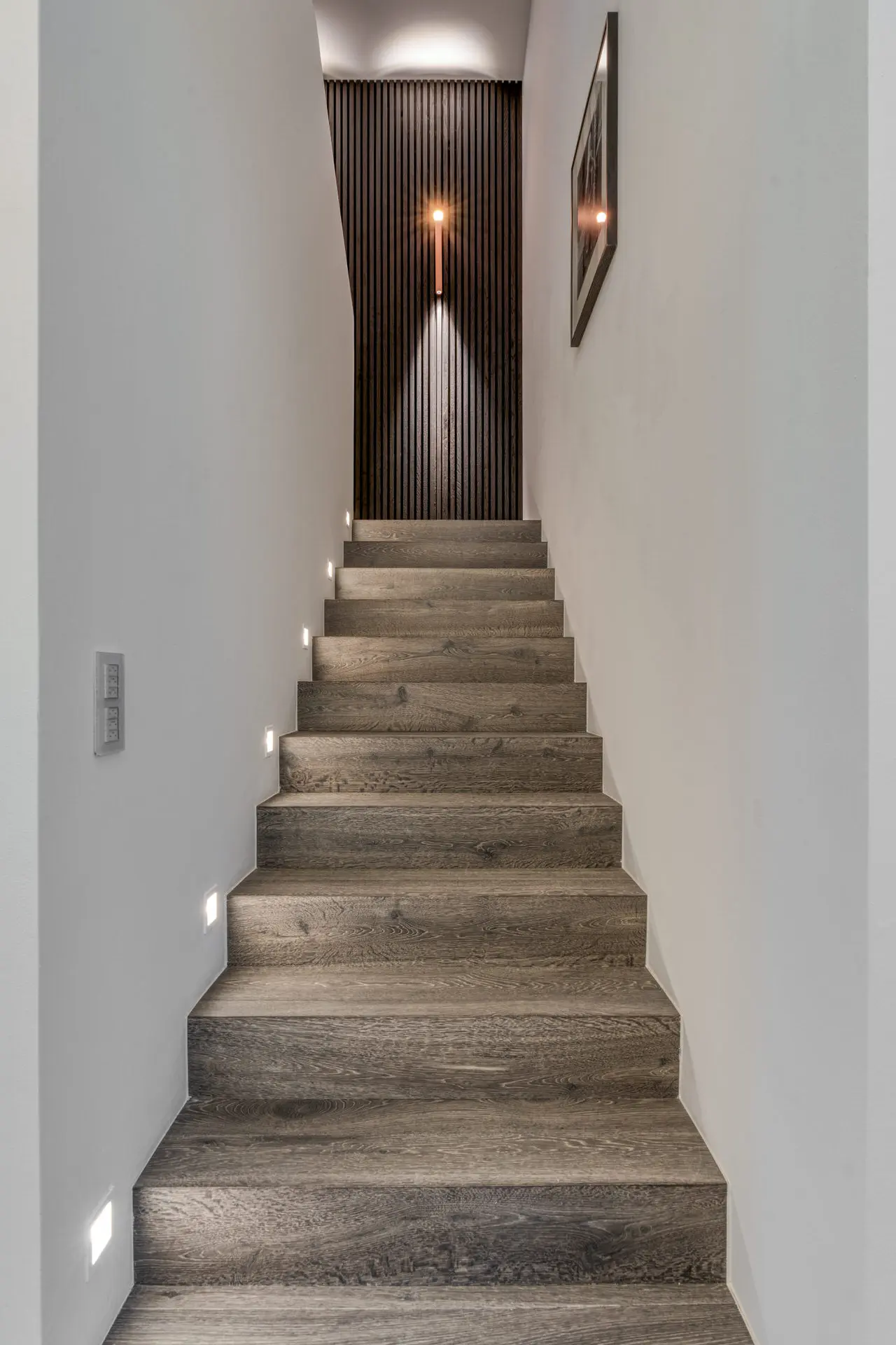 Oak staircase with slat wall detail in Kitzbuehel luxury villa