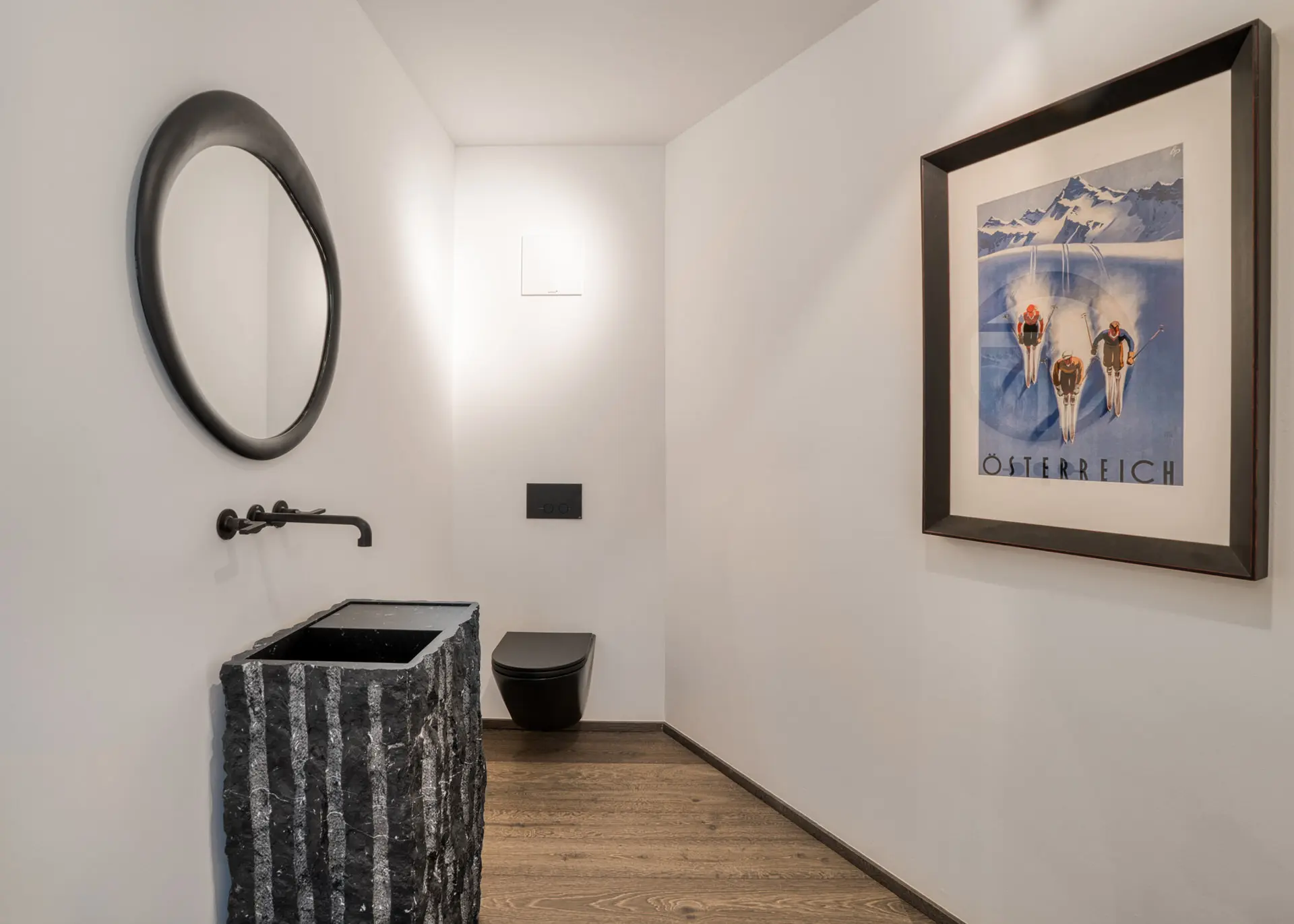 Powder room with marble pedestal in Kitzbuehel private residence